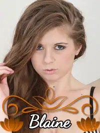 Portrait of a woman with long brown hair and a serious expression