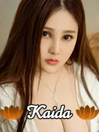 Portrait of woman in white top with necklace