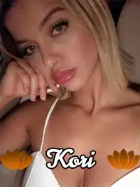 Woman posing indoors with 'Kori' text overlay