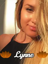 Smiling woman with long hair and lotus graphics in a sunny portrait