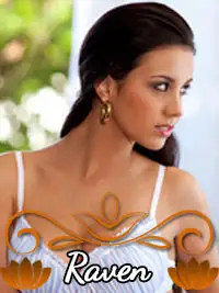 Raven woman in elegant white dress with floral decoration