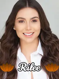 Smiling woman with long hair in a white shirt