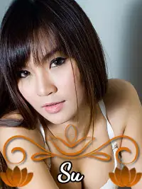 Portrait of woman with long hair and bangs, wearing a white top