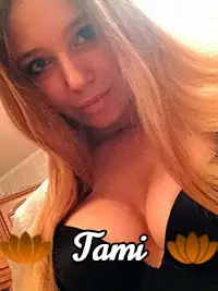 Young woman with long hair and black top