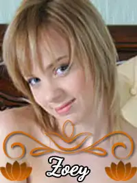 Woman with short blonde hair smiling in front of a headboard